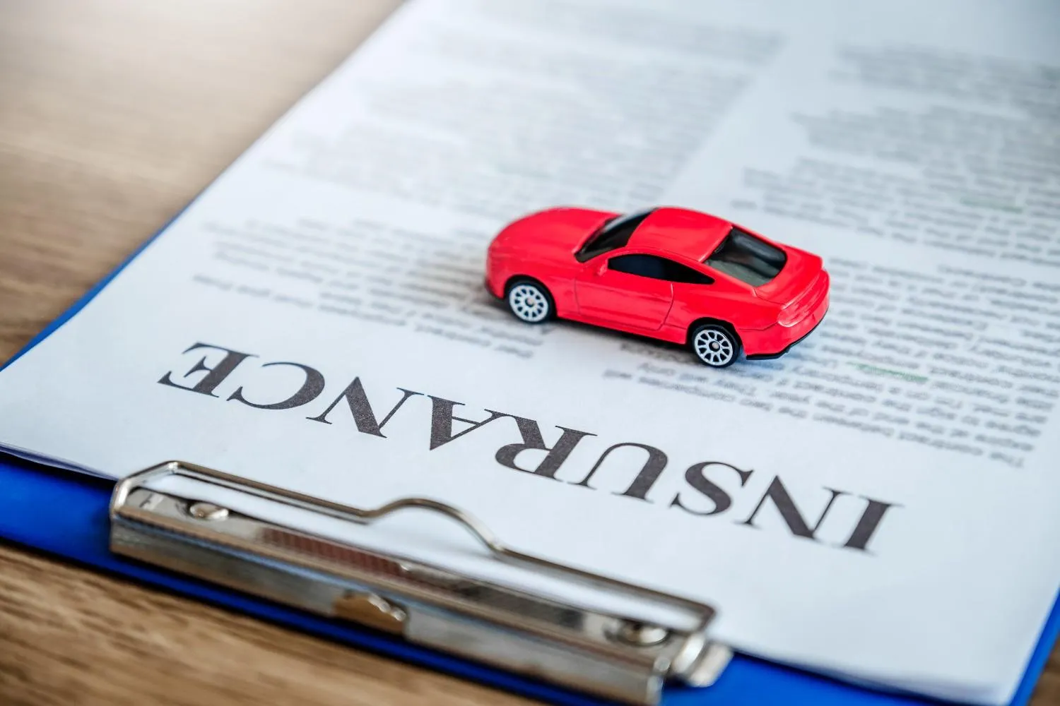 A driver reviewing an auto policy in plain view